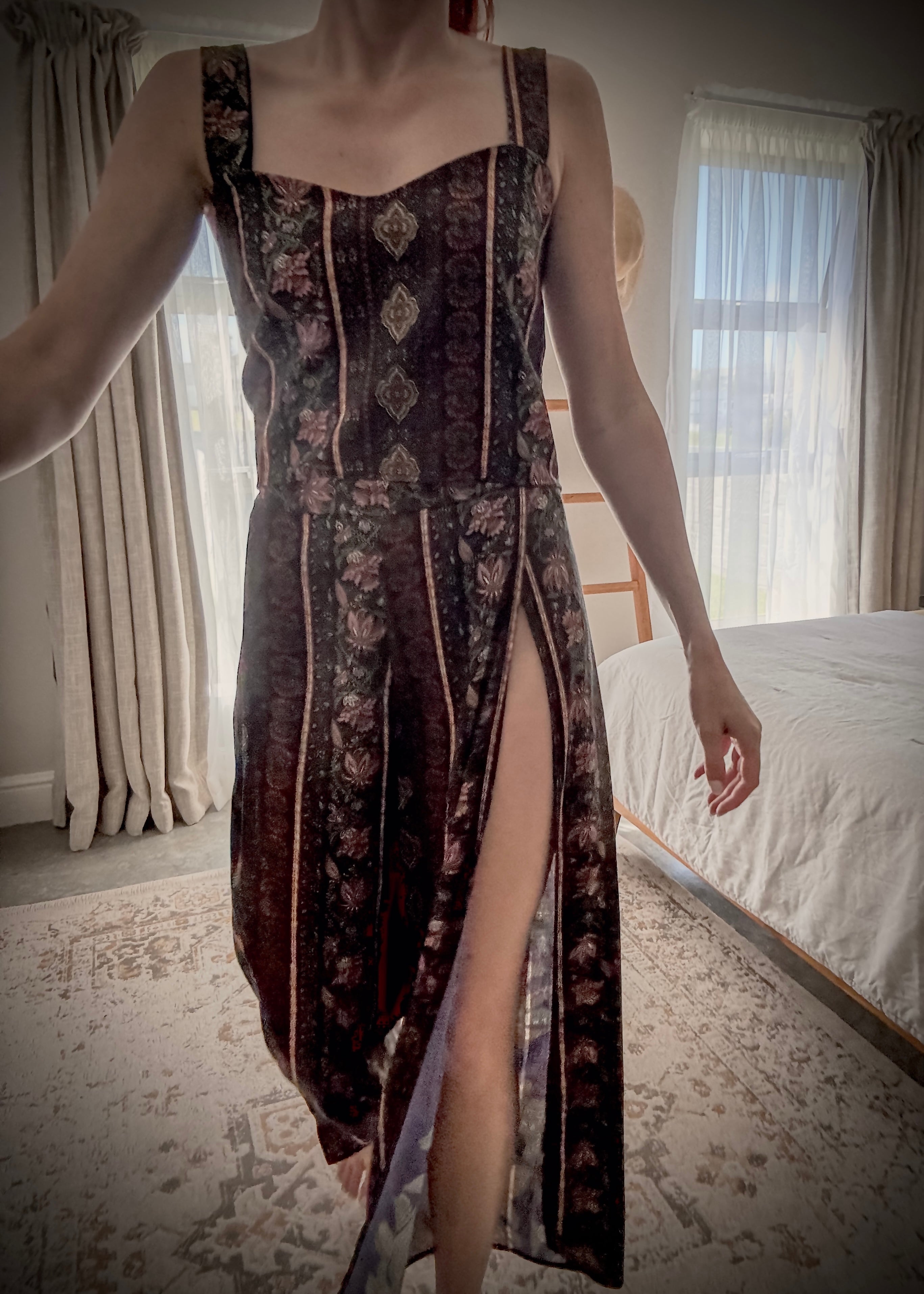 Person wearing a relaxed, floral patterned set with a high slit in pants made from ecovero viscose fabric.