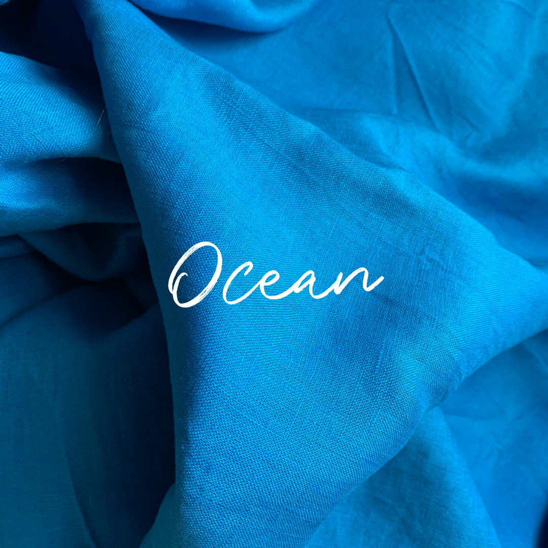 Blue pure linen fabric with 'Ocean' text in white.