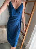 Woman wearing a steel blue Ecovero Viscose dress.